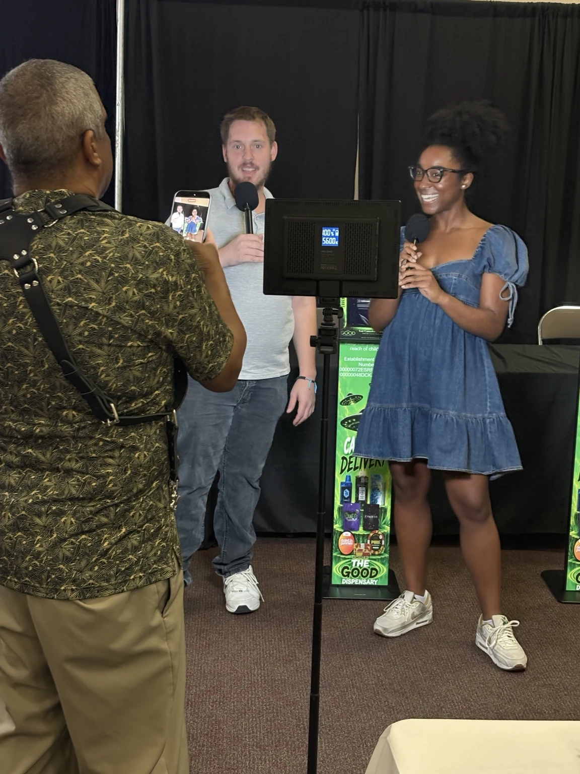 Joe Zielinski and Ashlynn Miller sharing LoveBud with customers at a community event